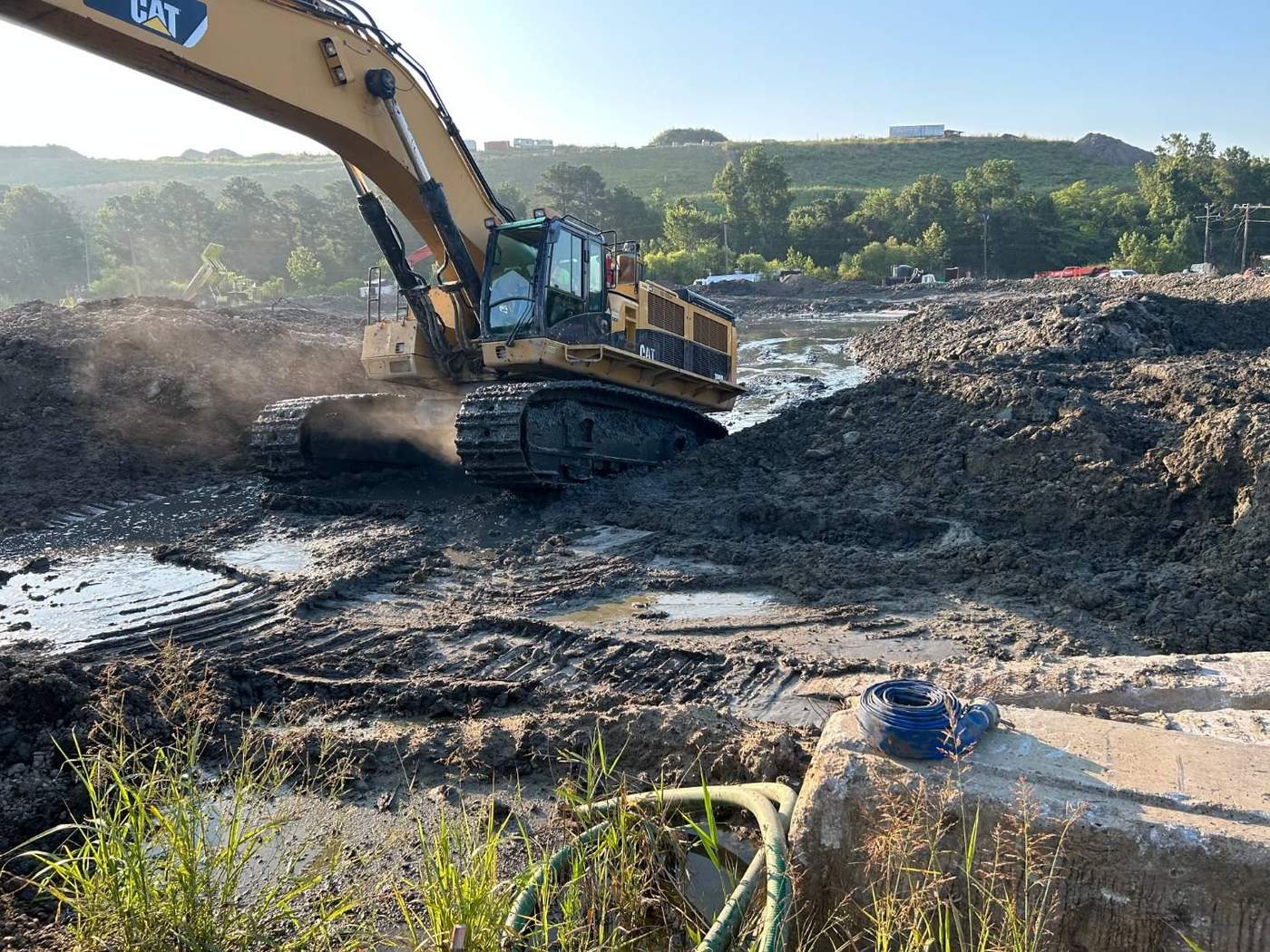 Excavator working a stormwater pond